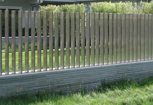 cantilevered steel fence on stone base