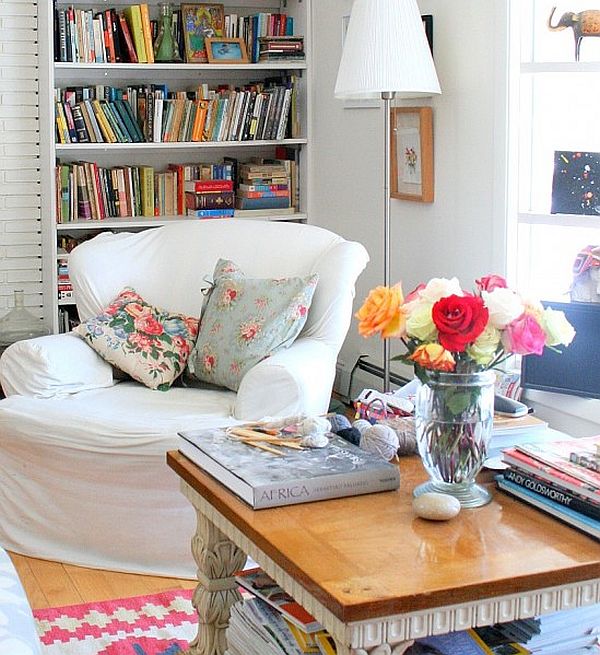 colorful reading area with white slip covers and floral contrasting cushions