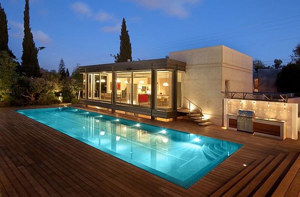 contemporary house with wooden deck and pool