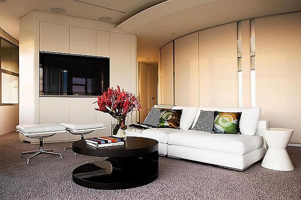 contemporary living room with white leather couch and black coffee table