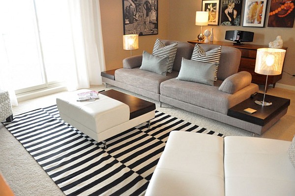 elegant living room with sofa and striped rugs