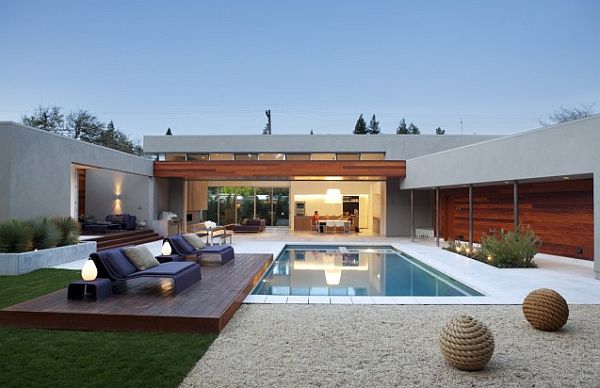 lap pool with raised deck and house view