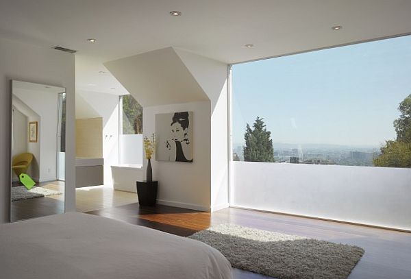 large bedroom with contemporary furniture and tall double glazing window