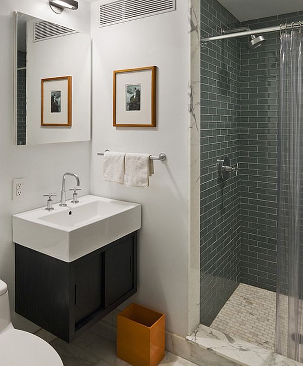 orange trash bin in modern bathroom for contrast