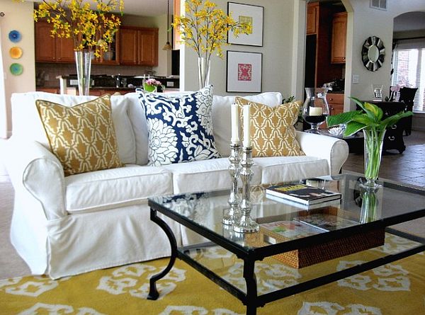 yellow and white slip covered sofa