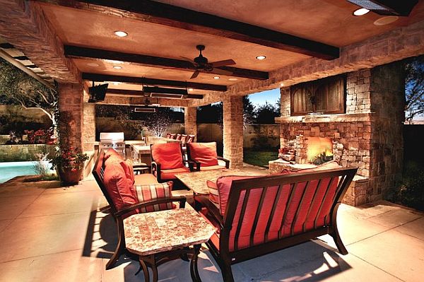 Cozy outdoor furniture setup with warm fireplace