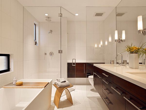 bathroom with wooden vanity and glass shower screen