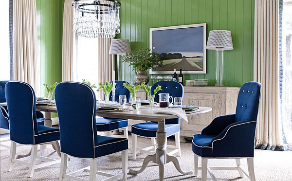 green wall dining room with blue navy chairs and white table