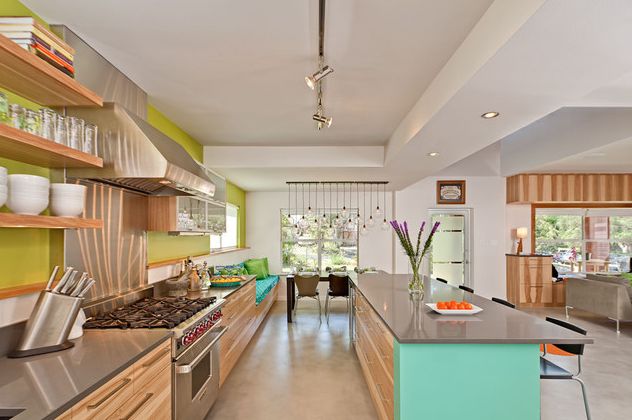 light wood kitchen furniture with lime green wall and open shelving