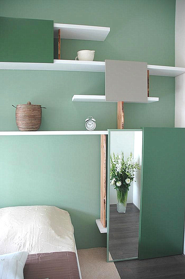 mint green room and shelving