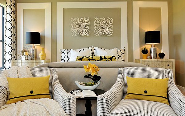 sleek bedroom design with yellow pillows and comfy chairs