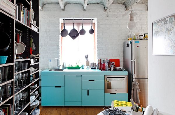 small apartment with white kitchen and blue cabinets furniture