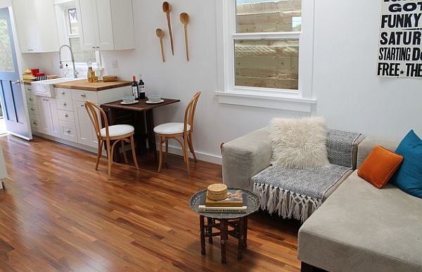 small open plan modern kitchen with fancy bentwood chairs