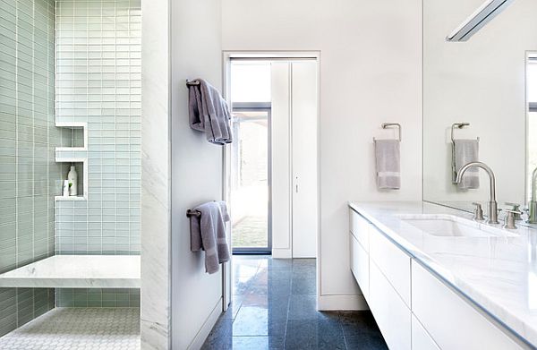 white and bright bathroom with doorless shower