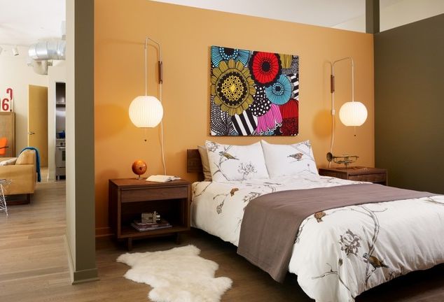 70s bedroom design - big flower-power wall art, hanging bubble pendants and a white shag throw rug