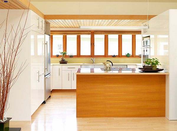 Kitchen with white cabinets and wood tone island