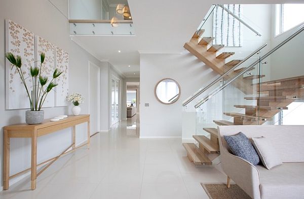 Modern wooden stairs with glass panel balustrade