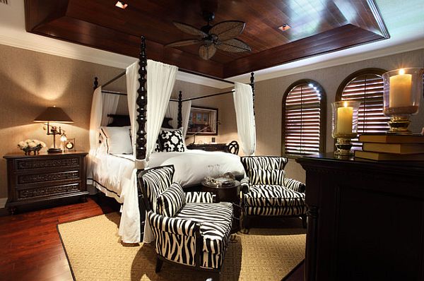 Beautiful african inspired bedroom with an ornamental canopy bed