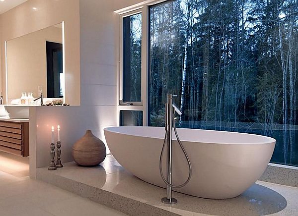 earth toned bathroom with forest views