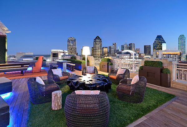 modern rooftop design with grass rug and confy rattan chairs