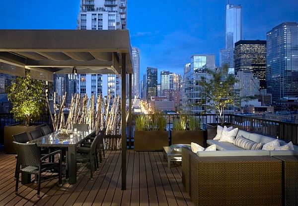 rooftop patio with dining table and relaxing area