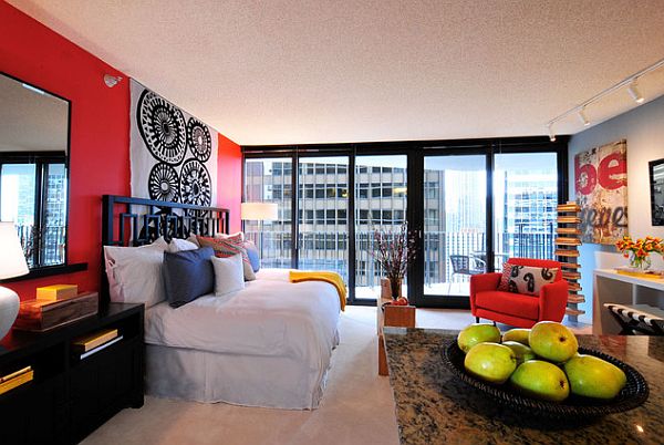 studio-apartment-bedroom-with-red-wall-in-the-back