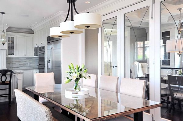 white themed dining room with modern hanging lamp