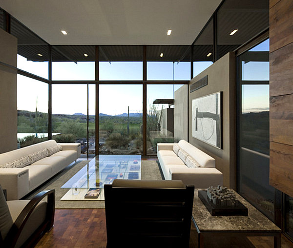 A living room with matching white sofas