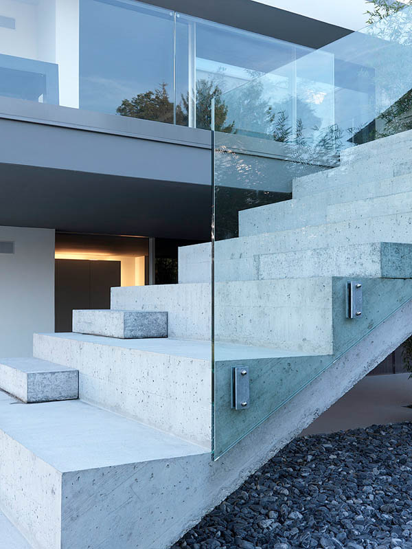 Glass Contemporary Feldbalz House - concrete and glass stairs