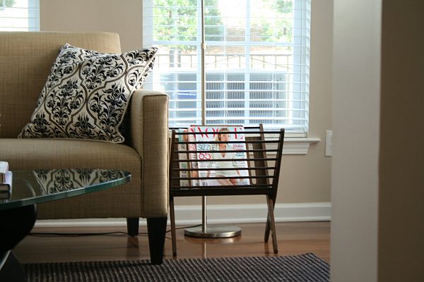 Living room couch with a stylish magazine rack