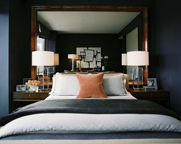 a pair of lamps and nightstands in an elegant bedroom