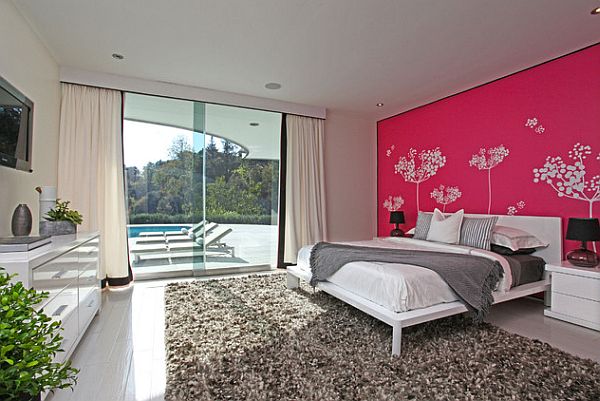 modern bedroom with pink wall and white trees