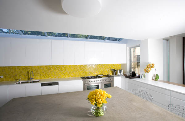 white kitchen design with yellow tiles