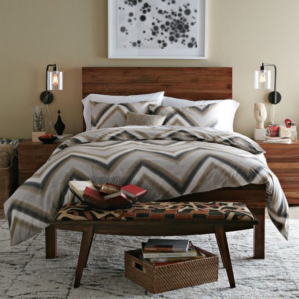 A bedroom featuring modern chevron bedding