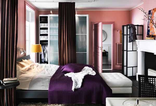 A compact bedroom with divider curtains