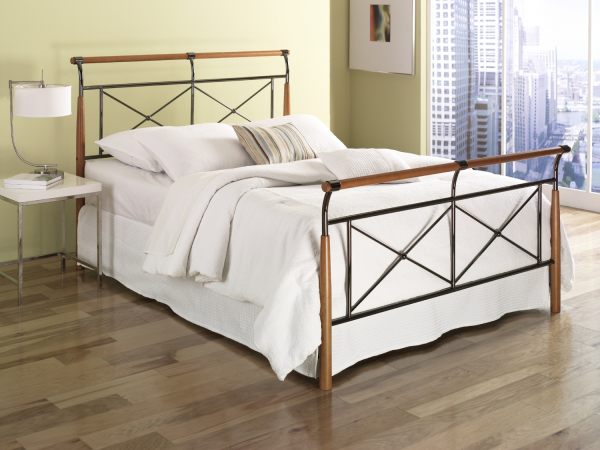 A contemporary metal and wooden bed