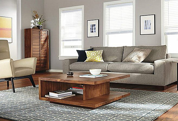 A living room with a coffee table that provides storage