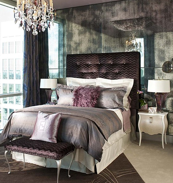 A purple bedroom with a reflective wall