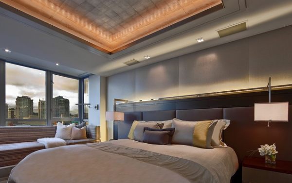 An elegant bedroom with contemporary lighting