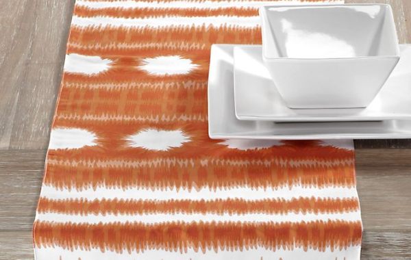 An orange and white table runner