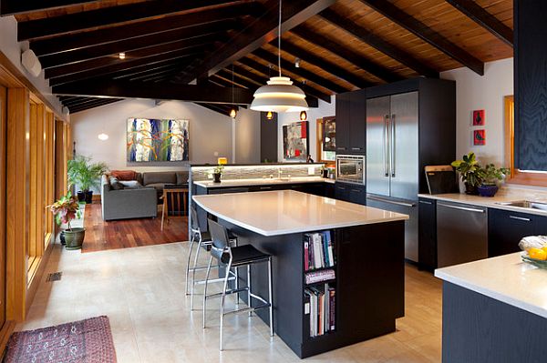 Black kitchen furniture with white glossy countertop