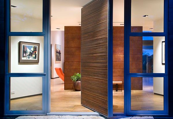 Blue glassy front door for a modern home