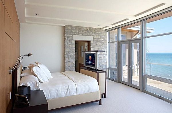 Modern-bedroom-with-TV-mounted-above-the-headboard