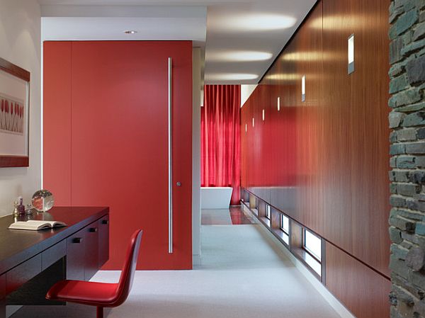 Red closet door and modern desk with storage