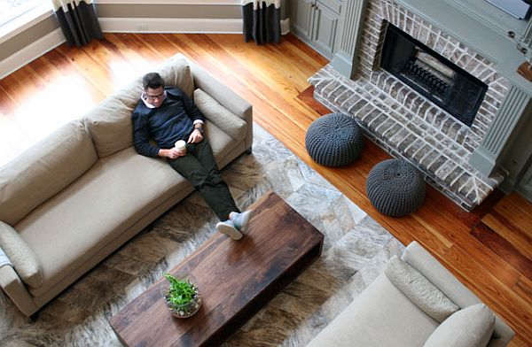 Stylish living room with poufs before the fireplace