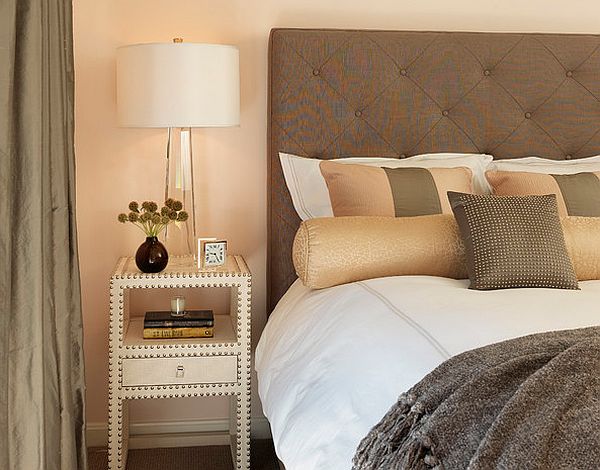 contemporary neutral colored bedroom with quilted headboard