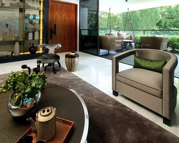 fancy living room with lush landscape outside