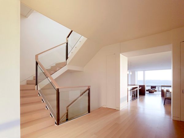 A glass and wooden handrail