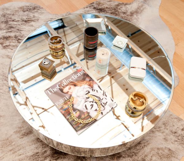 A round mirrored coffee table