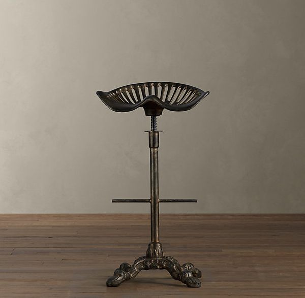 A tractor-style metal barstool